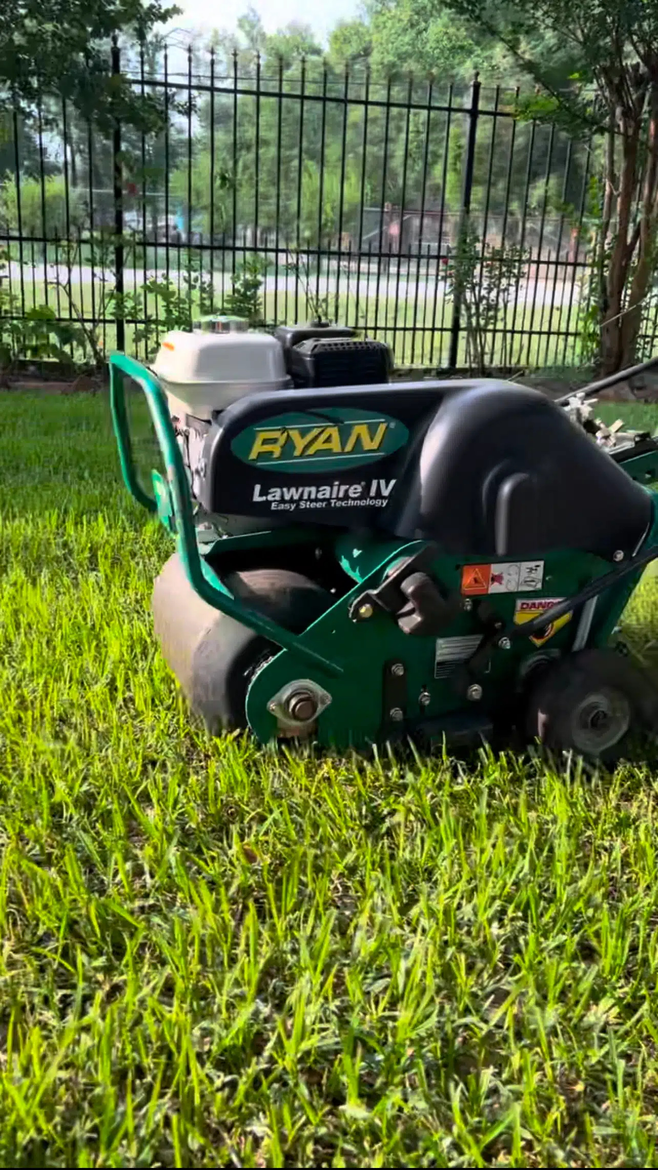 Core aeration in progress – A lawn undergoing professional aeration to enhance soil health, improve root growth, and achieve a thicker, greener appearance